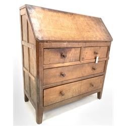 Peter 'Rabbitman' Heap of Wetwang - Yorkshire oak bureau, fall front enclosing fitted interior, above three long graduating drawers, raised on carved stile supports featuring rabbit signature (W92cm, H103cm, D45cm)