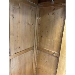 20th century satin walnut wardrobe, the projecting cornice over one mirror door and one drawer, raised on turned bun feet