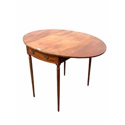 Early 19th century mahogany Pembroke table, the oval top with boxwood and ebonised stringing and rosewood band, drawer and faux drawer to each end, raised on turned supports 101cm x 77cm, H71cm