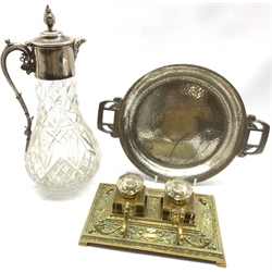 Art Nouveau Tudric Pewter circular twin handled dish L31cm, 19th century cast brass inkstand with two glass inkwells and a cut glass claret just with silver-plated mount (3)