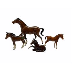 Beswick Spirit of Fire brown gloss horse no. 2829, John Beswick Chestnut Foal and Beswick brown gloss Shire Foal and a similar Royal Doulton Foal (4)
