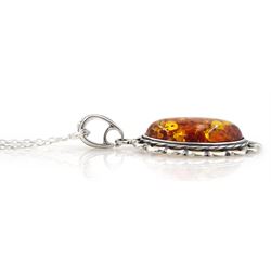 Silver oval Baltic amber pendant necklace, stamped 925