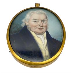 19th century oval miniature portrait, watercolour on ivory of a gentleman wearing a blue coat and yellow waistcoat 7cm x 5cm.  Trade card inside, incomplete, inscribed 'Mr Thomas Miniature Painter' possibly Thomas Cox. This item has been registered for sale under Section 10 of the APHA Ivory Act