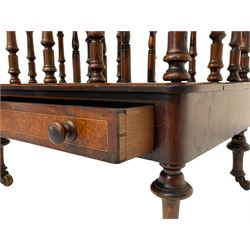 Victorian walnut and amboyna Canterbury or magazine rack, three divisions on turned balustrade supports, fitted with single drawer, on turned feet with brass and ceramic castors