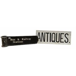 Cast metal 'Bus & Railway stations' sign, together with a sign reading 'Antiques'
