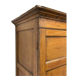 George III scumbled pine housekeeper's cupboard on chest, projecting moulded cornice over two panelled doors enclosing two shelves, the lower section fitted with three long drawers with turned handles, shaped apron on tapering bracket feet, scumbled paint finish to resemble oak 