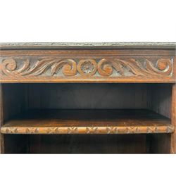 Carolean Revival - Victorian carved oak open breakfront bookcase, the edge carved with foliate detail over a banded frieze with scrolling foliage carvings, fitted with nine adjustable shelves, each column flanked by acanthus decorated uprights, the shelf front edges carved with egg and dart motifs