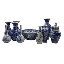 Early 20th century and later Japanese blue and white vases and bowls to include a trio with wavy rims, pair of bottle vases, pair of graduated bowls etc 
