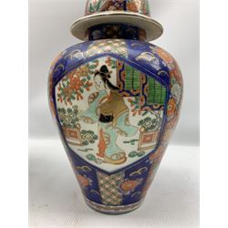 Japanese Imari baluster form vase with cover decorated in the typical palette together with another depicting traditional scenes max H32cm
