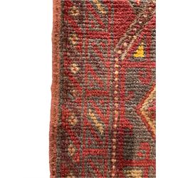 Meshwani indigo and maroon ground runner rug, the field with three lozenges with central amber roods and polygon borders, the border with geometric shapes