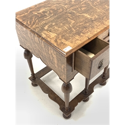 17th century style oak lowboy, fitted with three drawers, raised on turned supports united by shaped stretcher