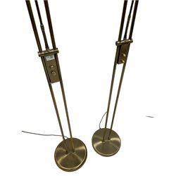 Two bronze finish metal uplighters, with adjustable reading lamps