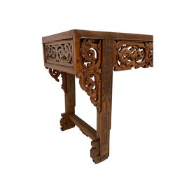 Large 19th century Chinese hardwood altar table, rectangular top over frieze pierced and carved with scrolls and dragon heads, the upright supports carved with vase and trailing foliate, scroll carved and pierced corner brackets and panelled sides