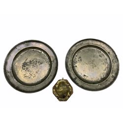 Gilt metal crest mounted on an oak panel, possibly the Bailey family W17cm and a pair of late 18th century pewter chargers D46cm