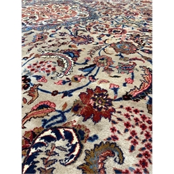 Persian Meimeh ground carpet, floral medallion on busy brown field, enclosed by double guarded border,  395cm x 290