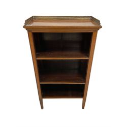 Small Edwardian inlaid mahogany open bookcase, raised three-quarter gilt metal fretwork gallery over two open shelves flanked by satinwood banded uprights, on square tapering supports