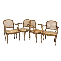 Set of four French beech bergere chairs, shield back and seat with cane panels, swept open arms, raised on cabriole supports W55cm