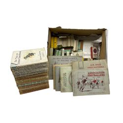  Collection of seventeen Beatrix Potter books, six with dust wrappers, six cigarette card albums including Association Footballers 1935-1936 and a number of loose cards 