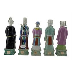 Set of ten 18th century Chinese figures of Immortals, painted in famille rose enamels, modelled standing on rectangular plinths and holding his or her respective attributes, including Cao Guojiu, Han Xiangzi, He Xiangu, Lan Caihe, Li Tieguai, two figures of L Dongbin, Zhang Guolao, Zhongli Quan and Shoulao, H23cm max (10) Provenance: From the Estate of the late Dowager Lady St Oswald