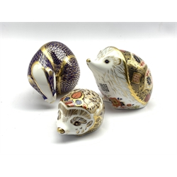 Royal Crown Derby 'Old Imari Hedgehog' with gold stopper, another 'Bramble Hedgehog', boxed and with gold stopper and another of a Badger with gold stopper