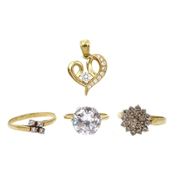 Three gold cubic zirconia rings and a gold cubic zirconia heart pendant, all hallmarked 9ct 
