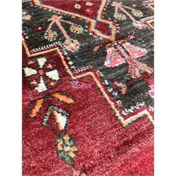 Persian Hamadan design hand knotted red ground rug with geometric medallion and stylised boarder 156cm x 300cm  