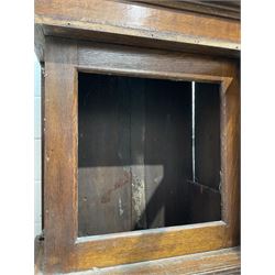  Mid-18th-century empty oak longcase - with an ogee caddy top above a broad moulded cornice, square hood door with attached pillars and wooden capitals, long trunk door on a square plinth with an applied decorative and shaped skirting, square dial mask with a 12” aperture.