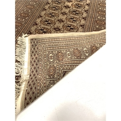 Persian design Bokhara rug, gul motif on beige field enclosed by multi line border (96cm x 160cm) together with a similar rug (83cm x 140cm)