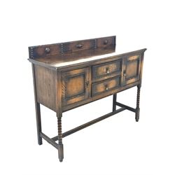 Early 20th century oak dresser, the raised back with applied carved decoration over two drawers and two cupboards, raised on bobbin turned front supports united by stretcher (W122cm, H100cm, D45cm) together with a Georgian oak three height plate rack (W120cm)