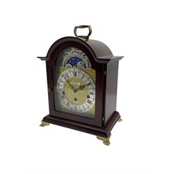 20th century mantle clock with a break arch top and three train Westminster chiming movement, with a brass dial and working moon dial feature, etched dial centre and spandrels, silvered chapter ring and steel hands, dial inscribed “H Samuel”, German eight-day spring driven Hermle movement with a floating balance escapement, chiming the quarters and hours on five gong rods. With Key. 