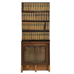 19th century secret door disguised as a bookcase, painted pine panelled door lined on one side with leather book spines over mahogany and glazed bookcase door with gilt metal grille (83cm x 201cm); a half panelled door lined with book spines to one side (83cm x 112cm); and two small mahogany bookcase doors with glass panes and gilt metal grilles (52cm x 61cm)