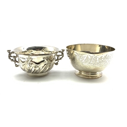 Victorian silver circular bowl engraved with foliage and laurel wreath cartouche D10.5cm London 1869 Maker John Hunt and Robert Roskell and a two handled silver bowl with embossed decoration and scroll handles Sheffield 1909 Maker Thomas Bradbury & Sons 10.6oz 
