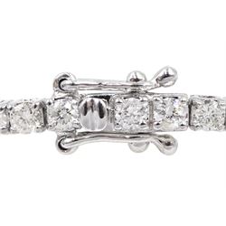 White gold round brilliant cut diamond line bracelet, stamped 18K, total diamond weight approx 2.50 carat 