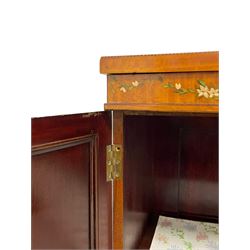 Edwardian satinwood side cabinet, rectangular top hand painted with trailing foliate and intertwined ribbon, enclosed by two panelled doors painted with laurel leaf wreaths, ribbons and scrolled lyres, the interior fitted with a single shelf, on bracket feet