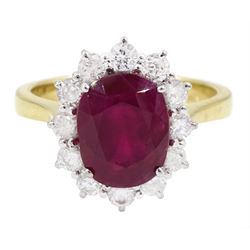 18ct gold oval cut ruby and round brilliant cut diamond cluster ring, hallmarked, ruby approx 3.40 carat, total diamond weight approx 0.65 carat