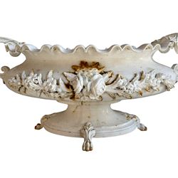 Corneau Alfred á Charleville - mid-19th century French cast iron planter, swollen and waisted oval form with scalloped upper rim, scrolled and ivy leaf cast handles, the front mounted by extending floral casting, on oval footed base with foliage and paw cast feet, the interior with drainage holes, inscribed 'Corneau Alfred á Charleville No 3' 