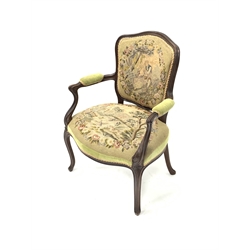 French style walnut open armchair, with needlework upholstered seat and back, raised on moulded cabriole supports, W67cm