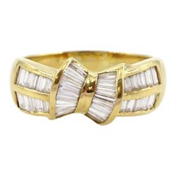 18ct gold tapered baguette cut diamond bow ring, with two row baguette cut diamond shoulders