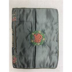 19th century embroidered binding, ‘De Rebus’, green silk ground embroidered with scrolling foliage and flowers within a rectangular panel, the spin with stitched title, border and sprigs of flowers and the owners monogram to the other side, 30cm x 20cm 