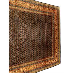 Arrak indigo ground rug, the field decorated with small repeating Boteh motifs, multiple band border, the main band with trailing pattern decorated with small stylised motifs