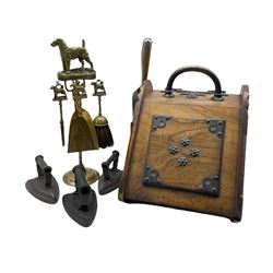 Victorian walnut coal box with gothic brass mounts, a brass wirehaired fox terrier three piece companion stand, together with three flat irons