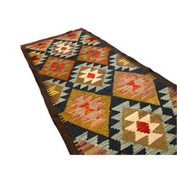Maimama Kilim runner rug, the indigo field decorated with rows of lozenges in contrasting colours surrounded by a dark border