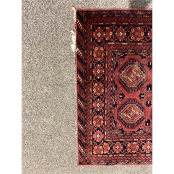 Persian red and blue ground rug decorated with Guls, 148cm x 99cm