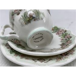 Royal Doulton Brambly Hedge miniature part tea set comprising two teapots, two milk jugs, sugar bowl, Winter and Summer trios and Autum cup and saucer (13 pieces)