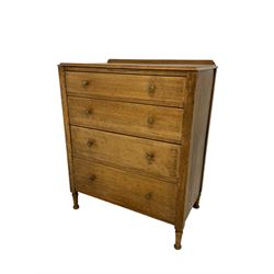 Early 20th century oak straight-front chest, fitted with four graduating drawers with octagonal brass handles, raised on turned supports with pad feet