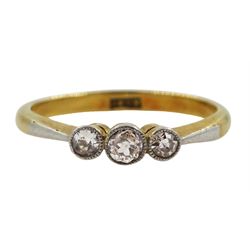 Early 20th century milgrain set three stone diamond ring, stamped 18ct 