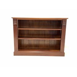 20th century mahogany two tier open bookcase, with fluted decoration, raised on plinth base W135cm, H98cm, D38cm