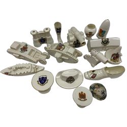Quantity of WWI crested ware including two tanks, field gun, French howitzer, barracks, two peaked caps, field glasses, Colonial hat etc by Arcadian, Savoy China and others (16)