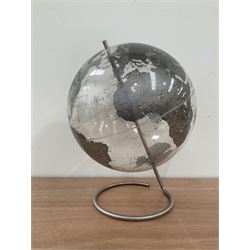 Modern desktop globe, together with various other items in a box 