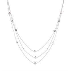 18ct white gold three row 'Diamond by the Yard' style necklace, thirteen bezel set round brilliant cut diamonds, total weight approx 0.65 carat, Birmingham 1997, retailed by Mappin & Webb, boxed